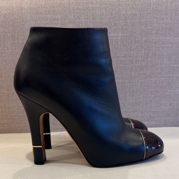 CHANEL Black Leather Heeled Boots with Gold Accents - Picture 2 of 7